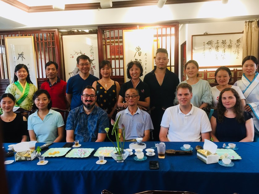 George with Classmates at a Tea Ceremony Event