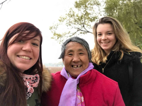 Emma and her class mate, with an old lady.