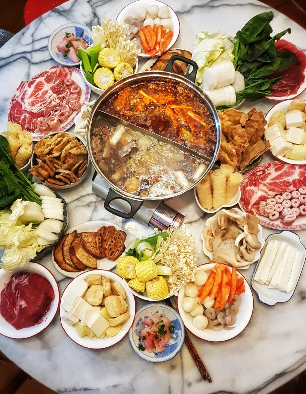 Hot pot split into two different flavors, spicy and light