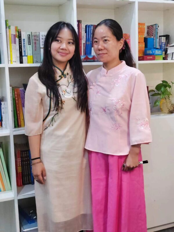 Teacher Qinqin with her Student