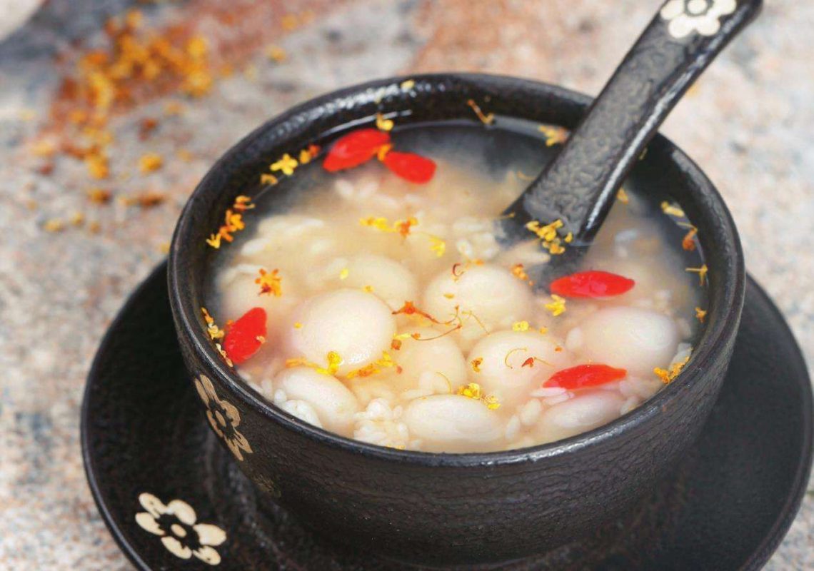 Rice balls in rice wine. 酒酿圆子. A Chinese dessert, pretty much.