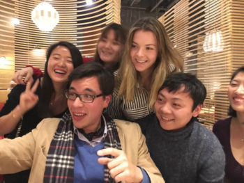 Group selfie in a restaurant