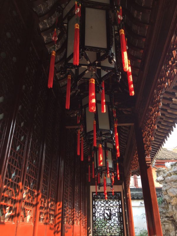 Yu Garden - Lanterns hanging from the roof of one of the buildings in the garden